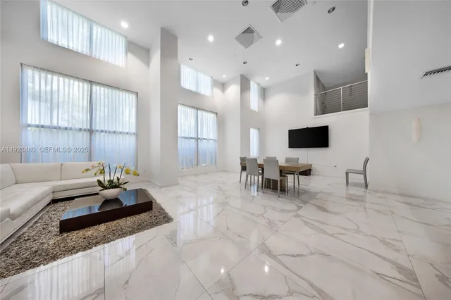 a lobby with furniture and window