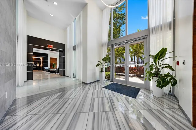 a gym room with gym equipment and a large window