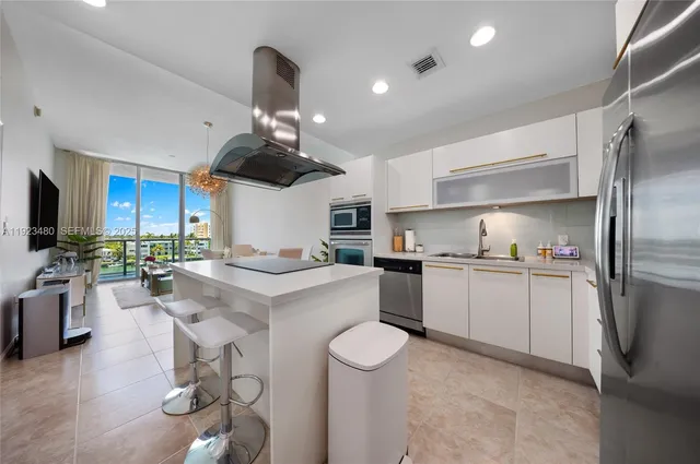 a kitchen with a sink stove and refrigerator