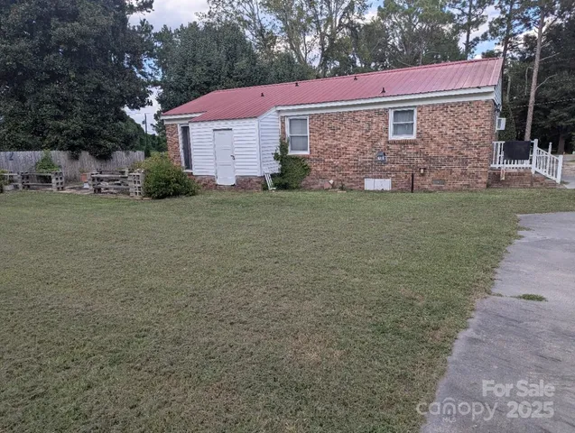 a view of backyard with outdoor space