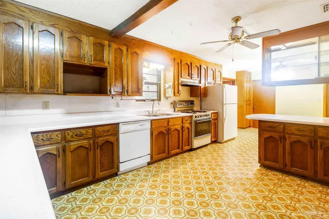 a view of a hallway with wooden floor and cabinet
