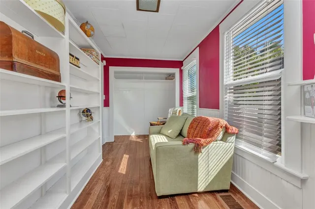 a dining room with furniture and window
