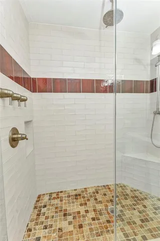 a kitchen with stainless steel appliances granite countertop a stove and a refrigerator