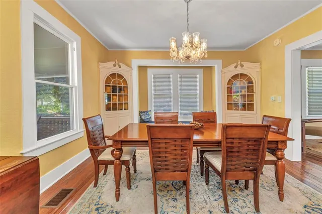 a view of entryway bedroom and hall with wooden floor