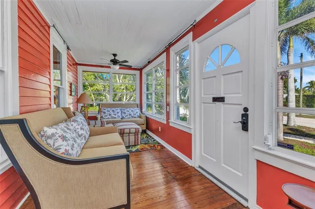 a dining room with furniture a rug and a large window