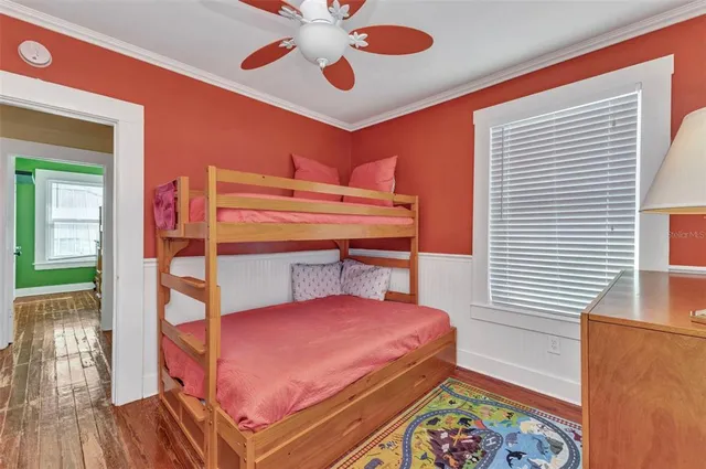 an aerial view of residential houses with outdoor space and swimming pool