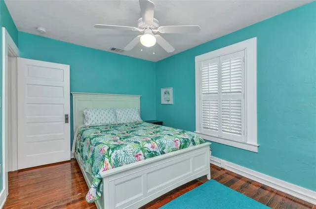 an aerial view of a house with a yard and plants