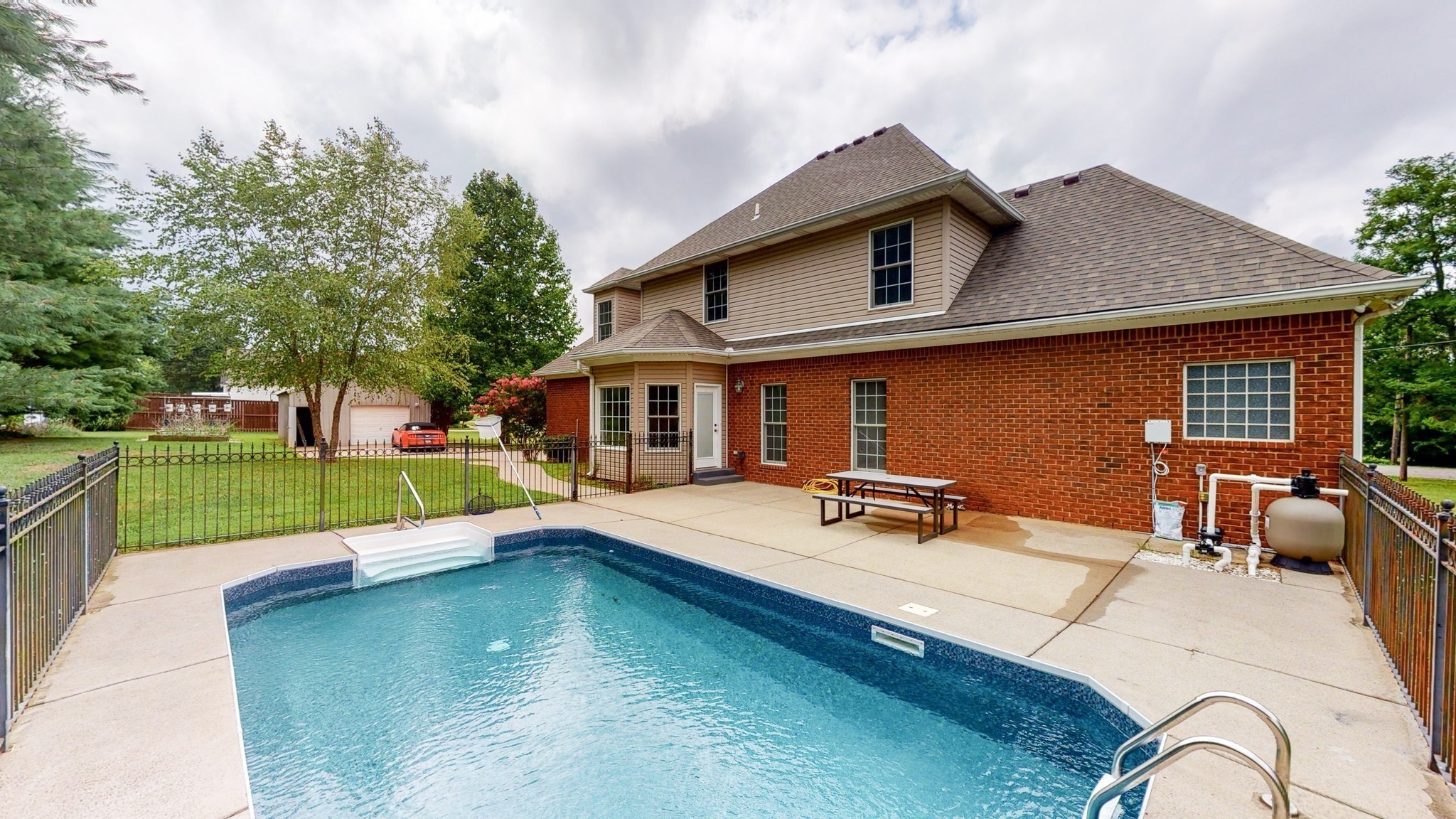 113 West Hester Road Cottontown, TN 37048 - Photo 2 of 21 a view of a house with swimming pool and sitting area