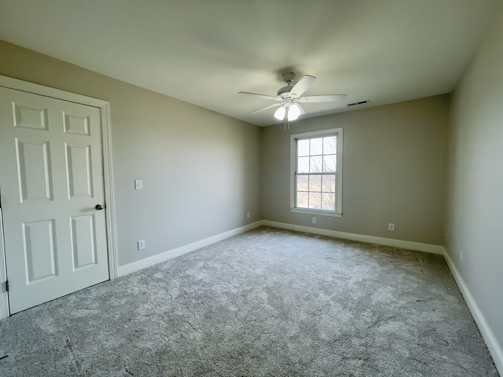 113 West Hester Road Cottontown, TN 37048 - Photo 21 of 21 an empty room with windows and ceiling fan