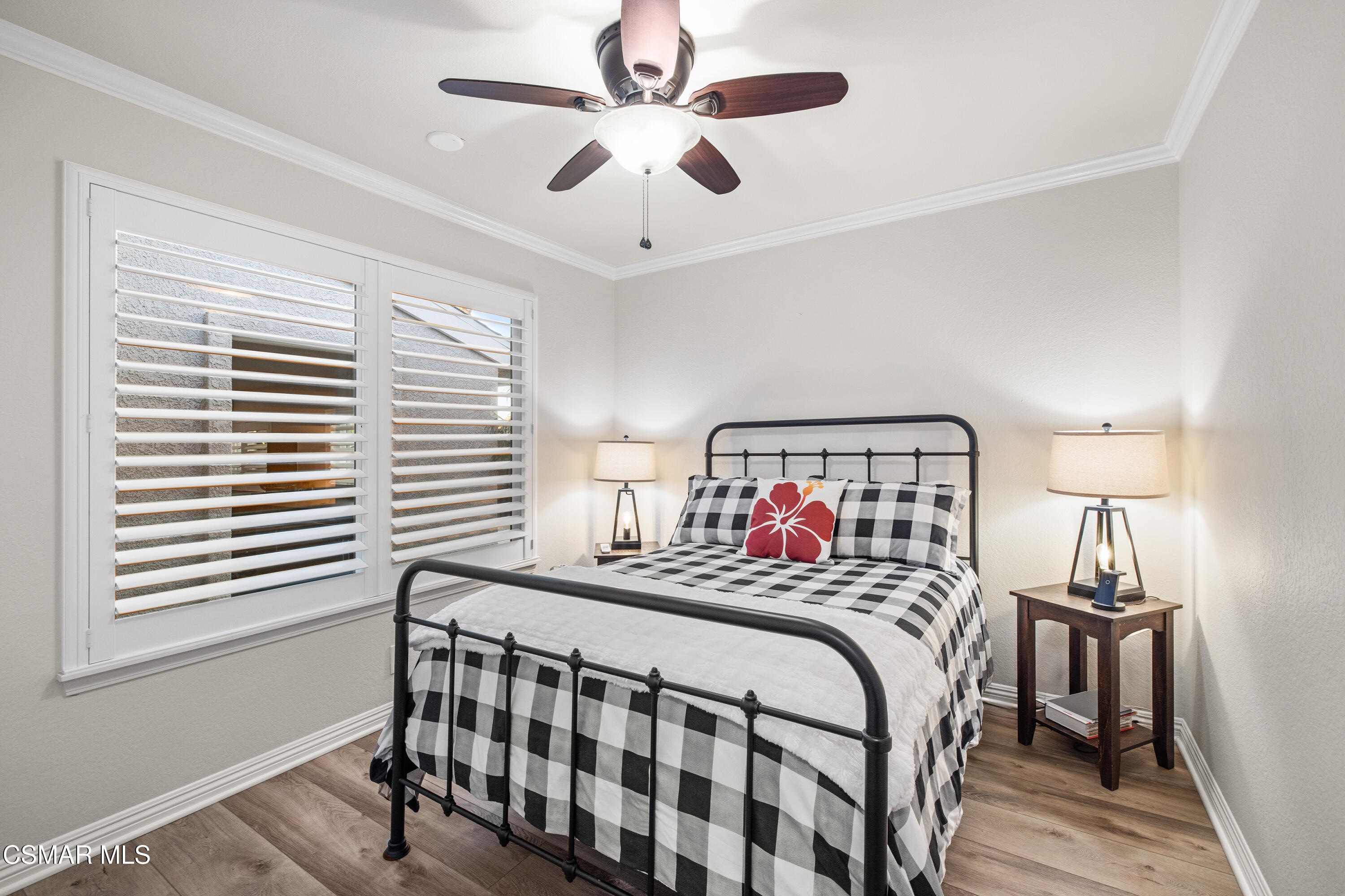 5200 Prairieview Street Camarillo, CA 93012 - Photo 13 of 24 a bedroom with a bed and a chandelier