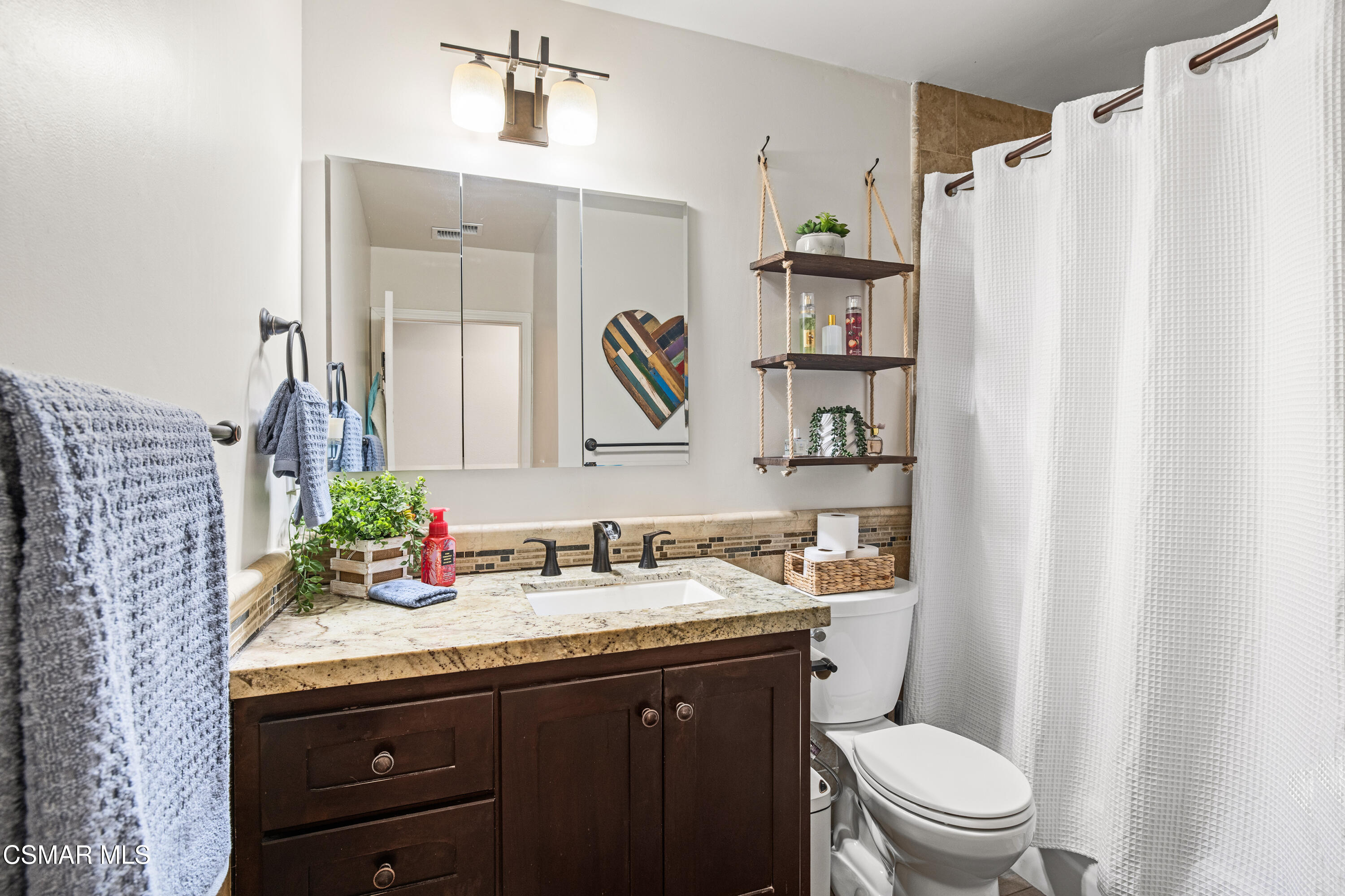 5200 Prairieview Street Camarillo, CA 93012 - Photo 14 of 24 a bathroom with a granite countertop sink toilet and shower