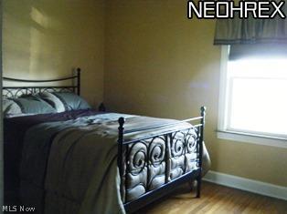 6899 Broadview Road Independence, OH 44131 - Photo 10 of 18 Large 1st floor bedroom with wood floor