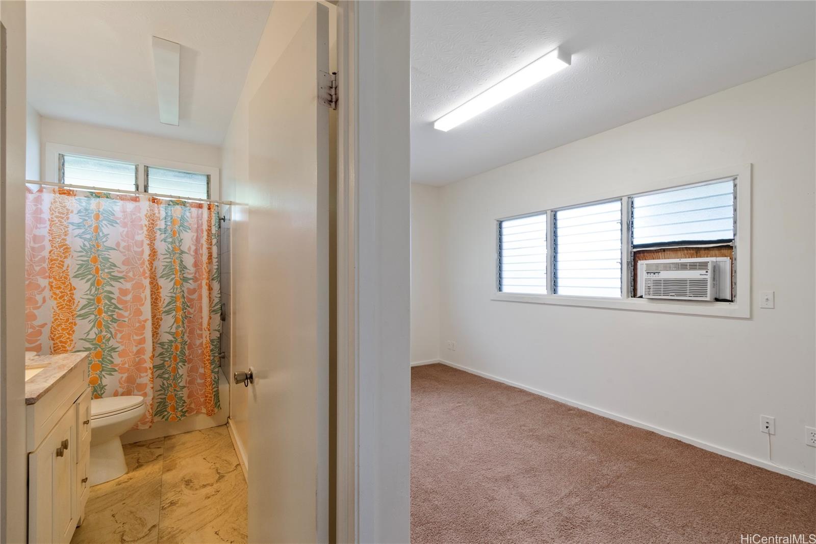 385 Kuliouou Road, Unit A Honolulu, HI 96821 - Photo 15 of 25 a bathroom with a toilet sink and shower
