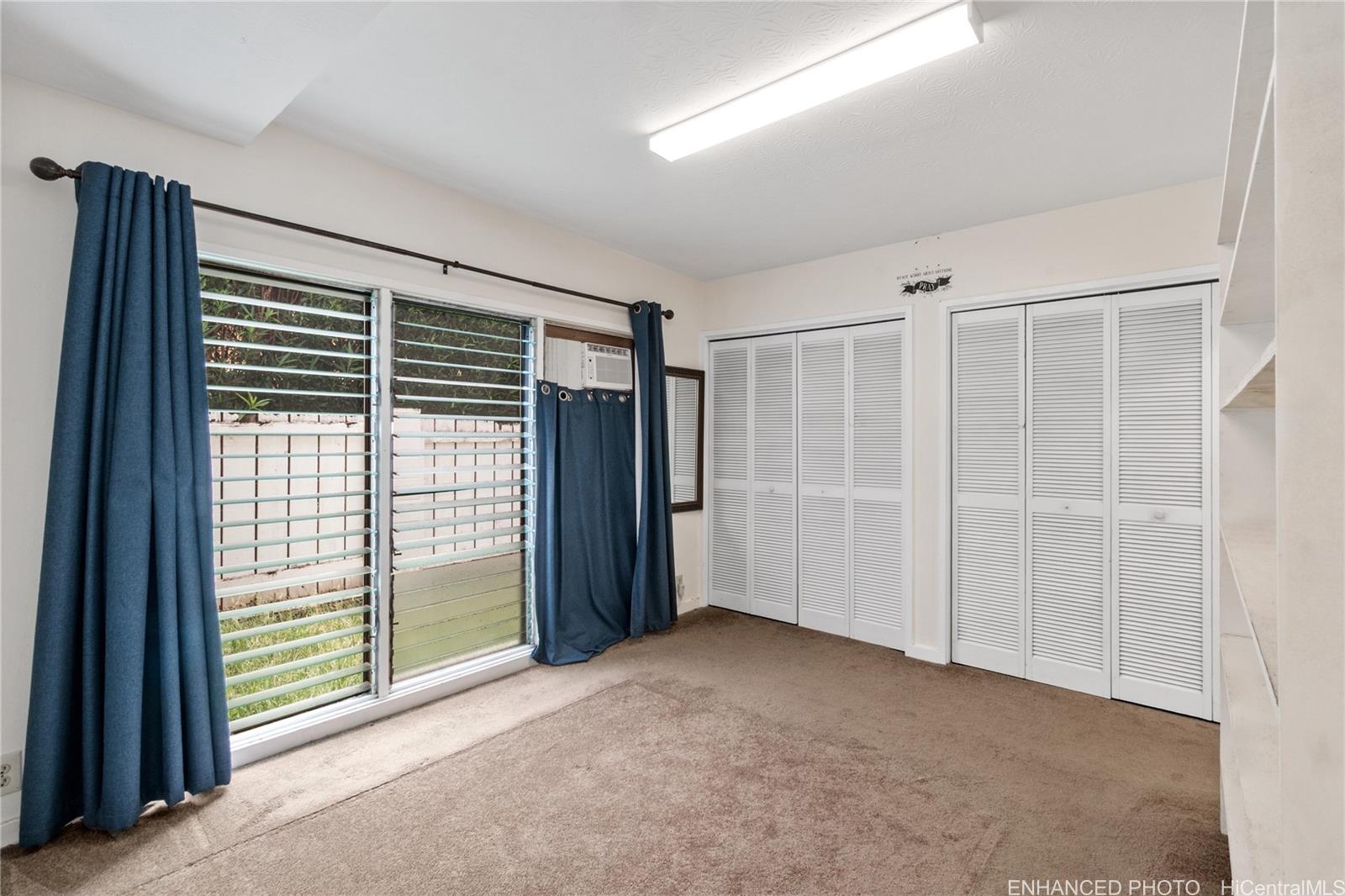 385 Kuliouou Road, Unit A Honolulu, HI 96821 - Photo 16 of 25 a view of empty room with floor to ceiling window