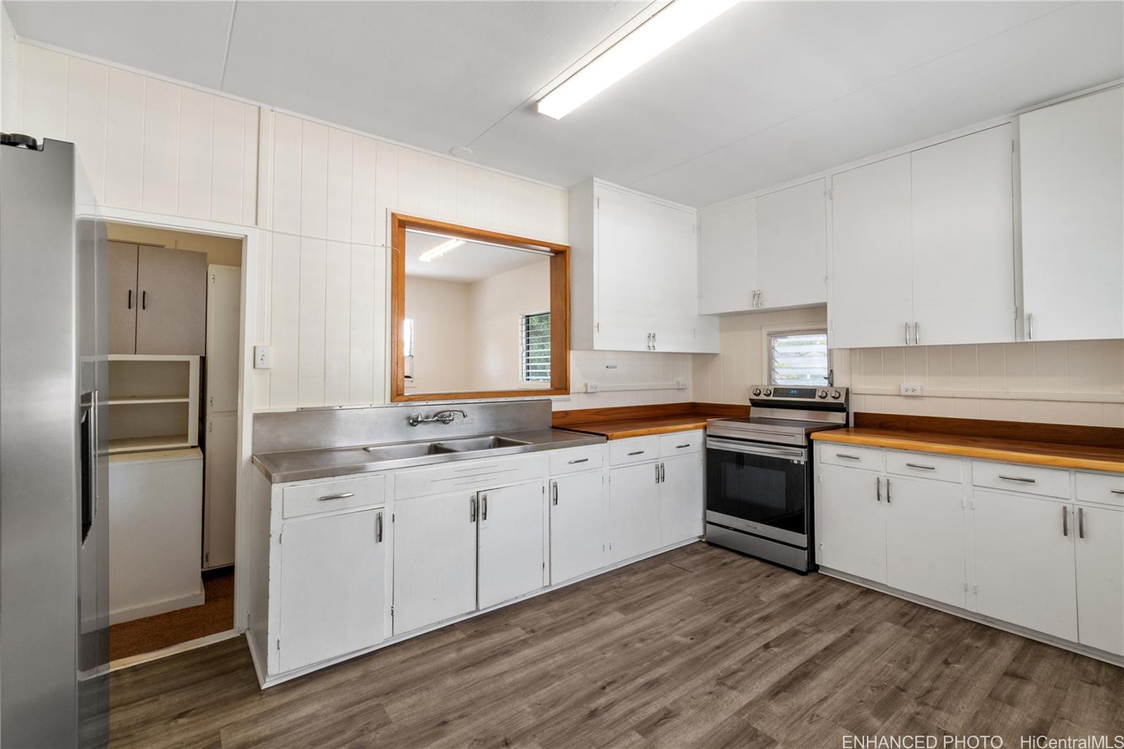 385 Kuliouou Road, Unit A Honolulu, HI 96821 - Photo 18 of 25 a kitchen with a sink stove and refrigerator