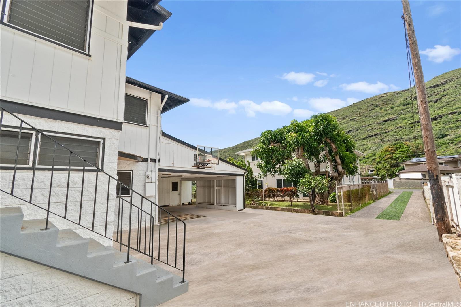 385 Kuliouou Road, Unit A Honolulu, HI 96821 - Photo 23 of 25 a view of a house with backyard and deck