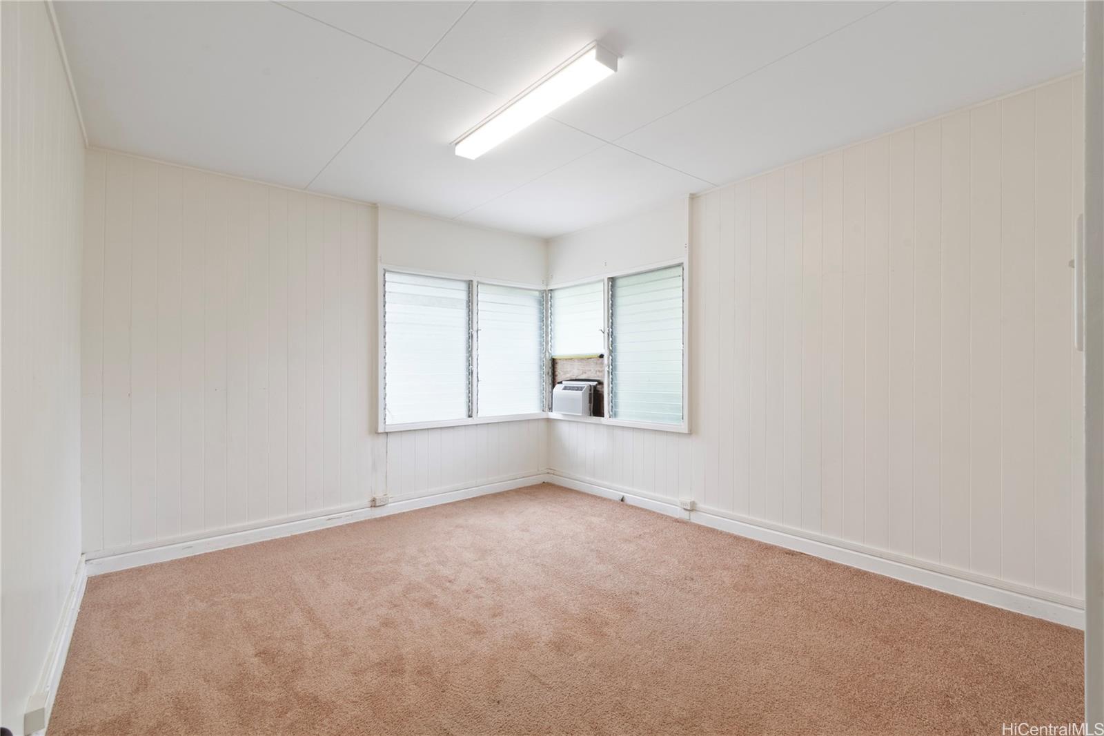 385 Kuliouou Road, Unit A Honolulu, HI 96821 - Photo 9 of 25 wooden floor in an empty room with a window