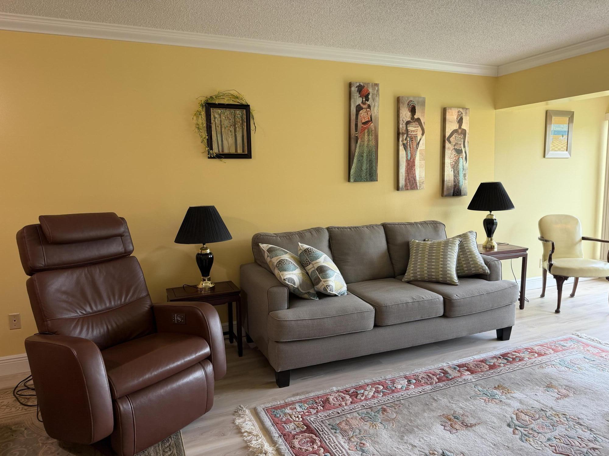 1121 Cactus Terrace, Unit 202 Delray Beach, FL 33445 - Photo 15 of 31 a living room with furniture and a couch