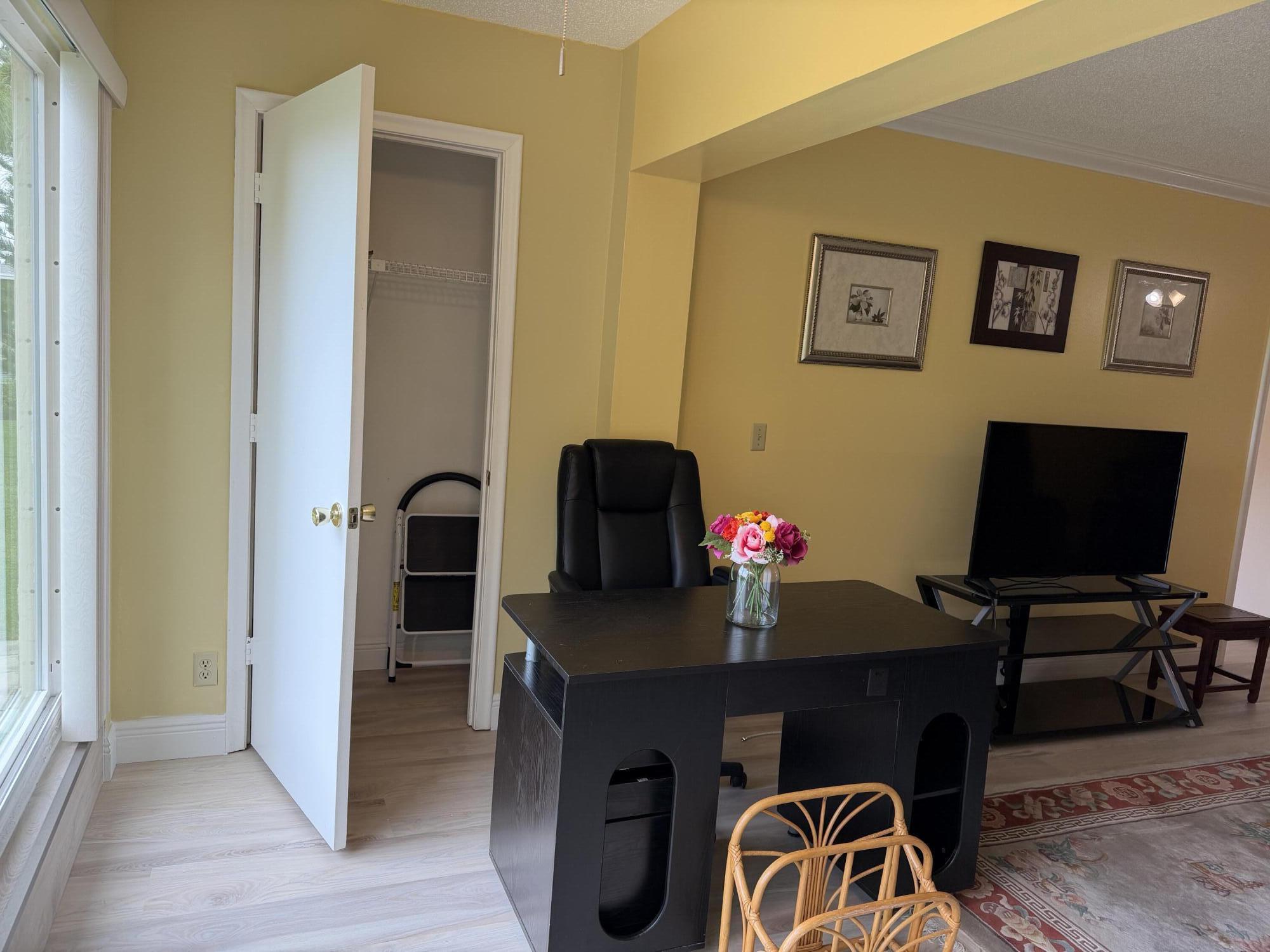 1121 Cactus Terrace, Unit 202 Delray Beach, FL 33445 - Photo 17 of 31 a workspace with furniture and wooden floor