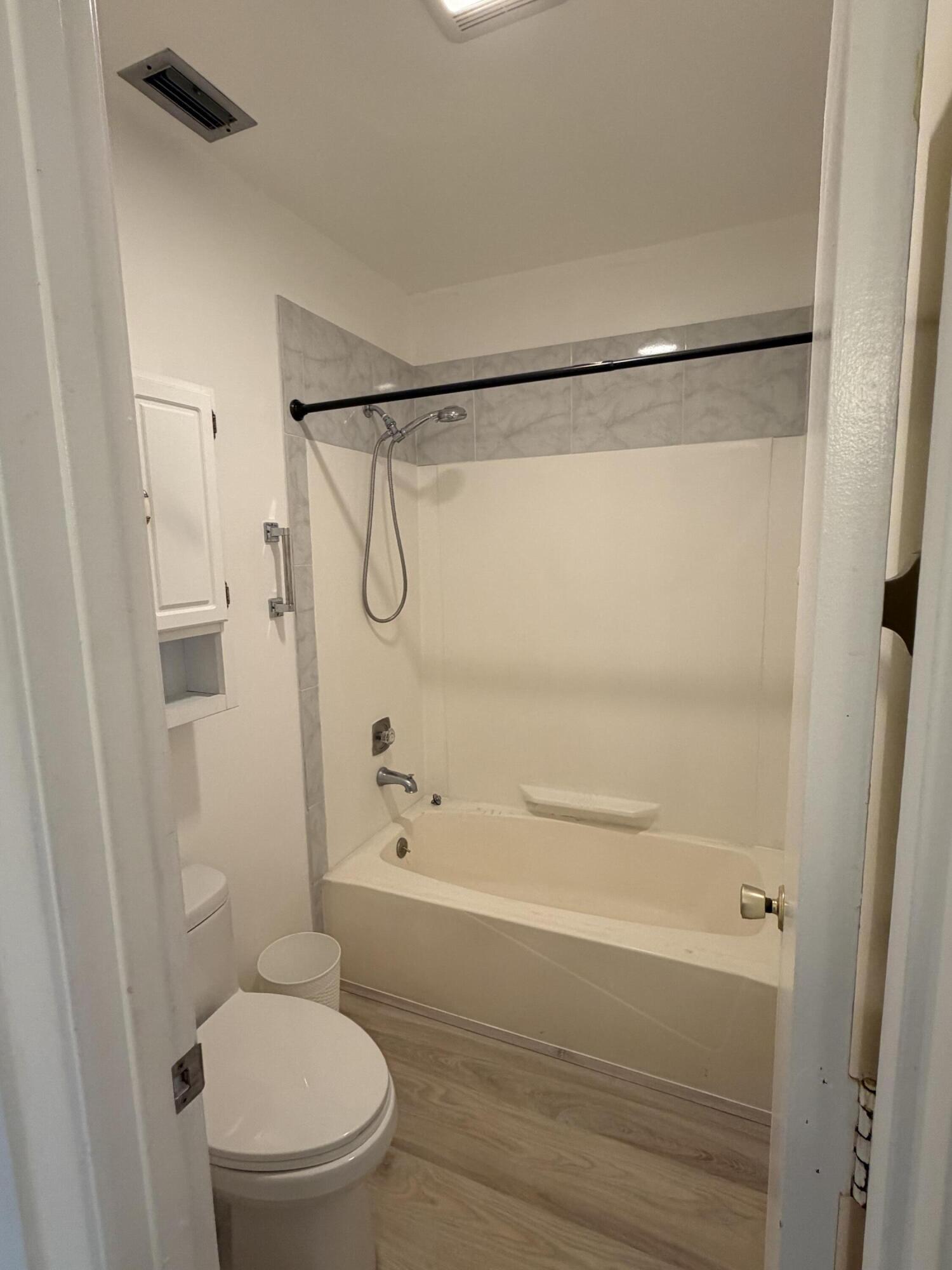 1121 Cactus Terrace, Unit 202 Delray Beach, FL 33445 - Photo 31 of 31 a bathroom with a shower and a toilet