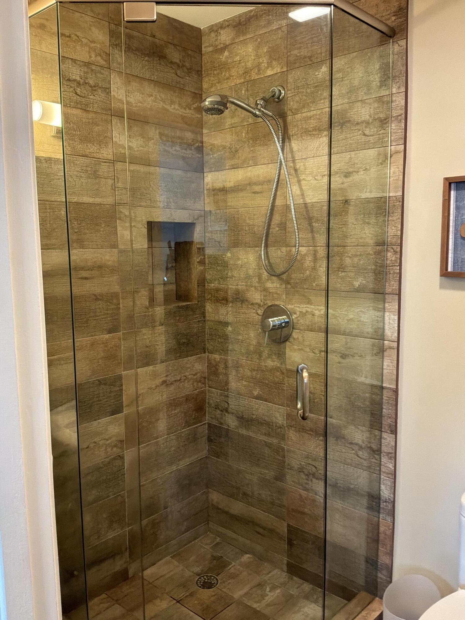 1121 Cactus Terrace, Unit 202 Delray Beach, FL 33445 - Photo 7 of 31 a bathroom with a shower