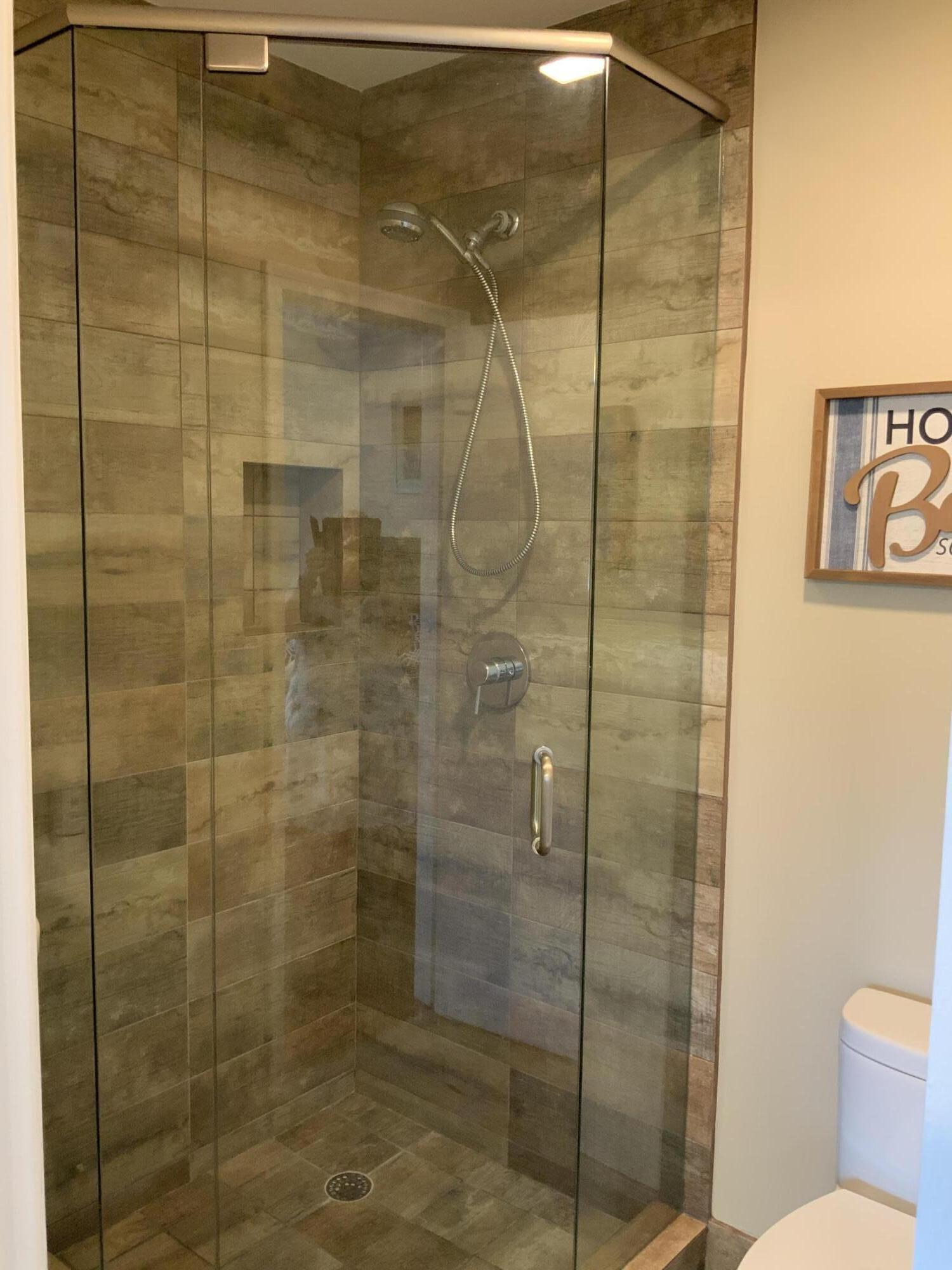 1121 Cactus Terrace, Unit 202 Delray Beach, FL 33445 - Photo 10 of 31 a bathroom with a shower