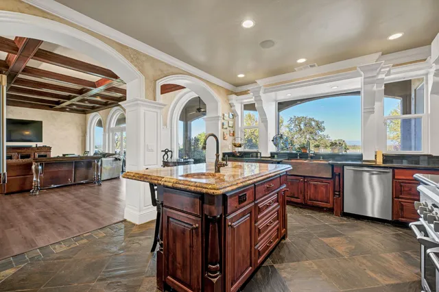 a kitchen with a stove and a sink