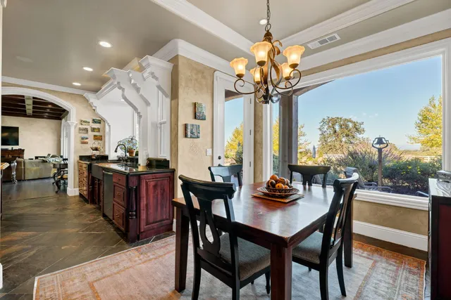 a hallway with stainless steel appliances a stove and cabinets