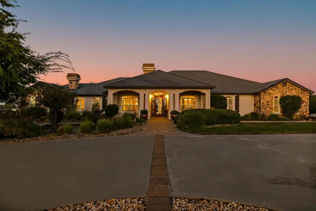 a front view of a house with yard