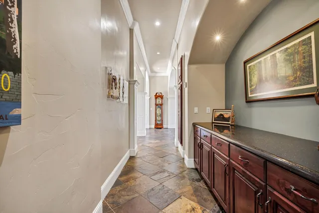 a view of a bathroom with a sink and a mirror