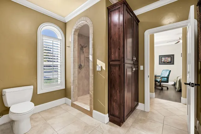 a bedroom with a bed and a table