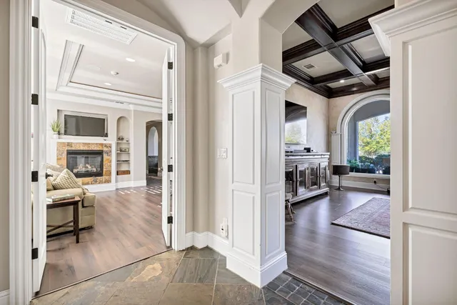 a bedroom with furniture and a flat screen tv