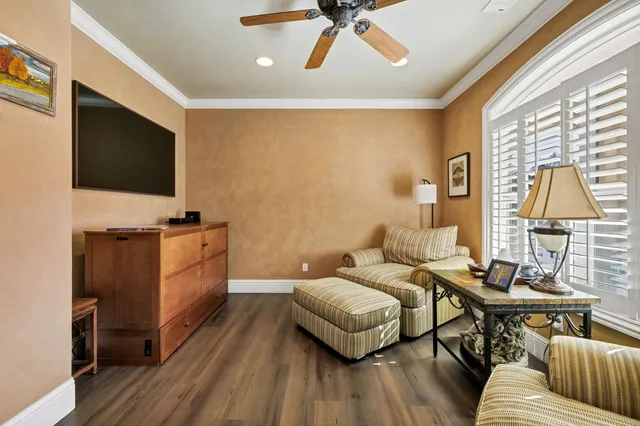 a bedroom with furniture and a window