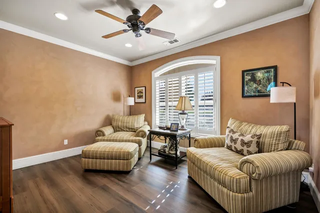 a spacious bathroom with a vanity a sink a mirror and a shower