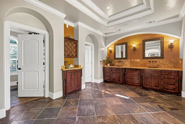 a view of swimming pool with outdoor seating and plants