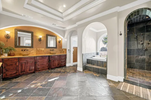 a view of swimming pool with outdoor seating and plants