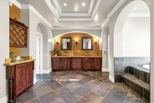 a view of swimming pool with lounge chairs