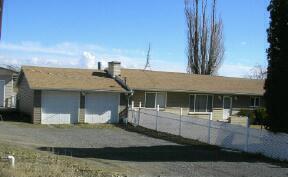 a front view of a house with garage