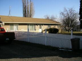 2161 St Hilaire Road Moxee, WA 98936 - Photo 2 of 4 a front view of a house with a yard