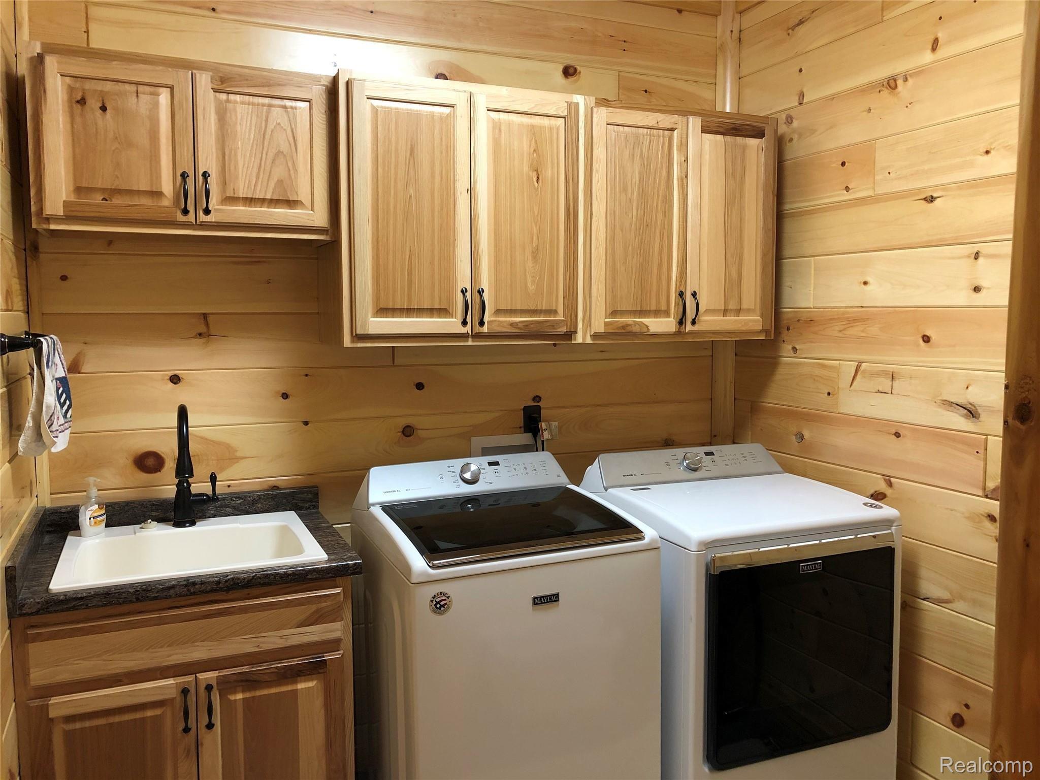 6263 General Squier Road Almont, MI 48003 - Photo 24 of 45 Laundry room with convenient laundry sink & ample storage