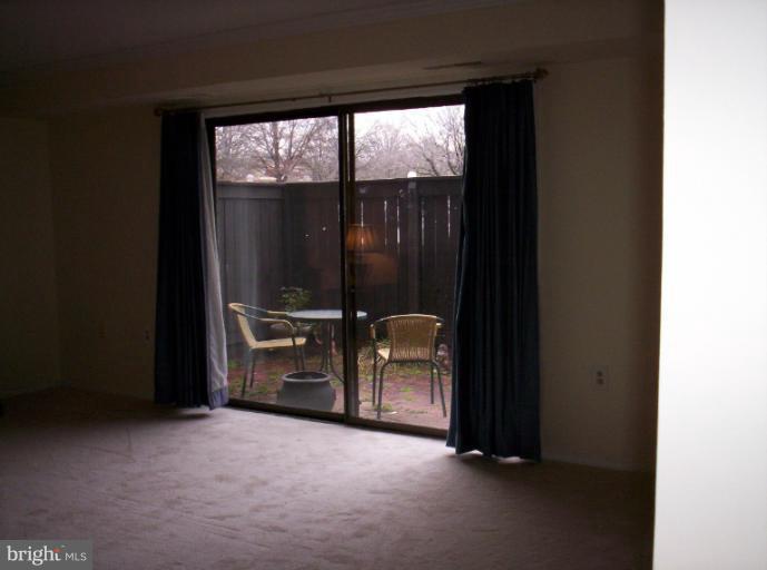 10026 Stedwick Road, Unit 101 Gaithersburg, MD 20886 - Photo 13 of 30 Living Room 2 View to Patio