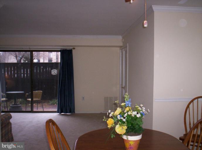 10026 Stedwick Road, Unit 101 Gaithersburg, MD 20886 - Photo 24 of 30 Dining Room View to Living Room and Patio