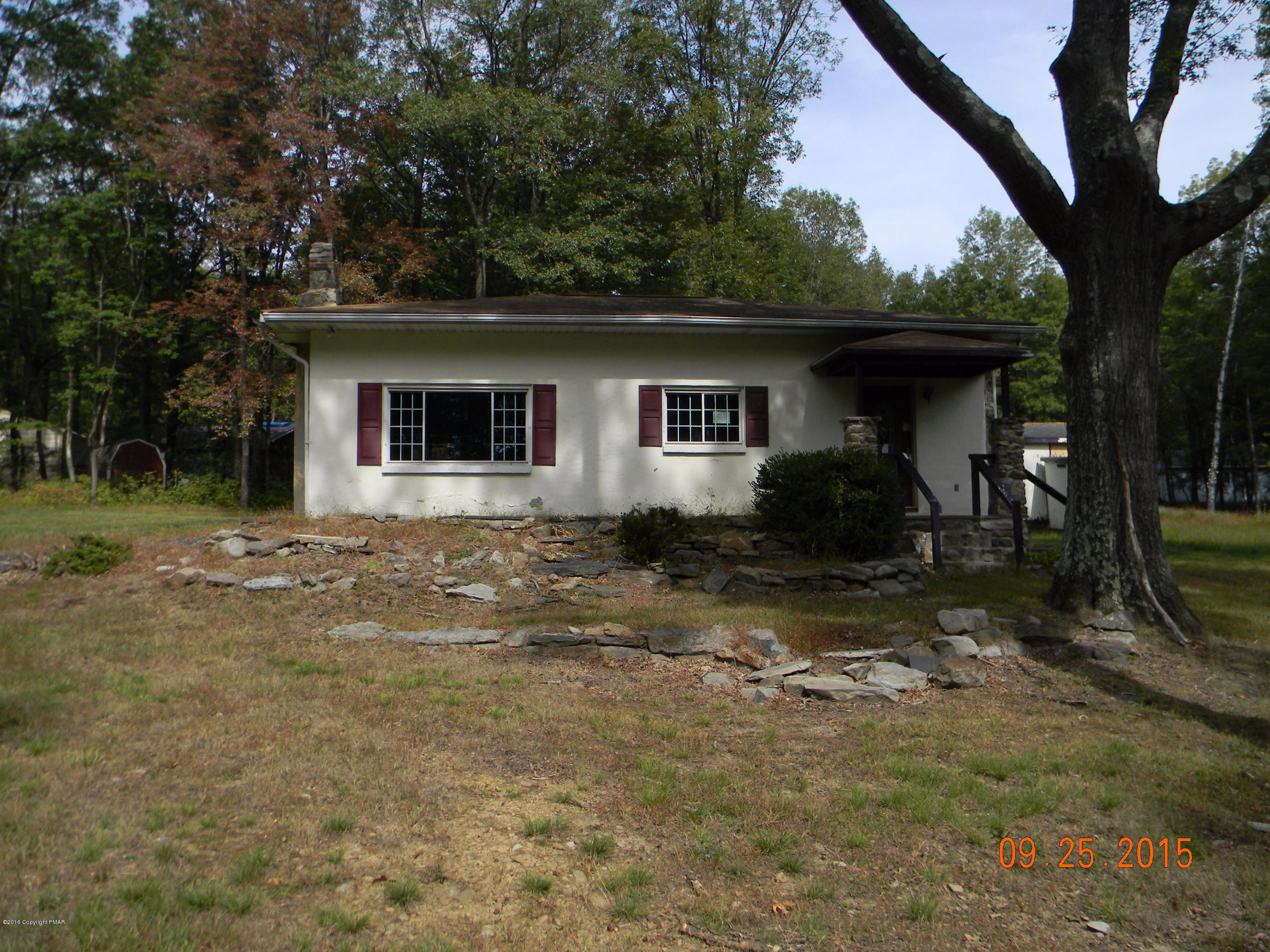 front view of a house with a yard