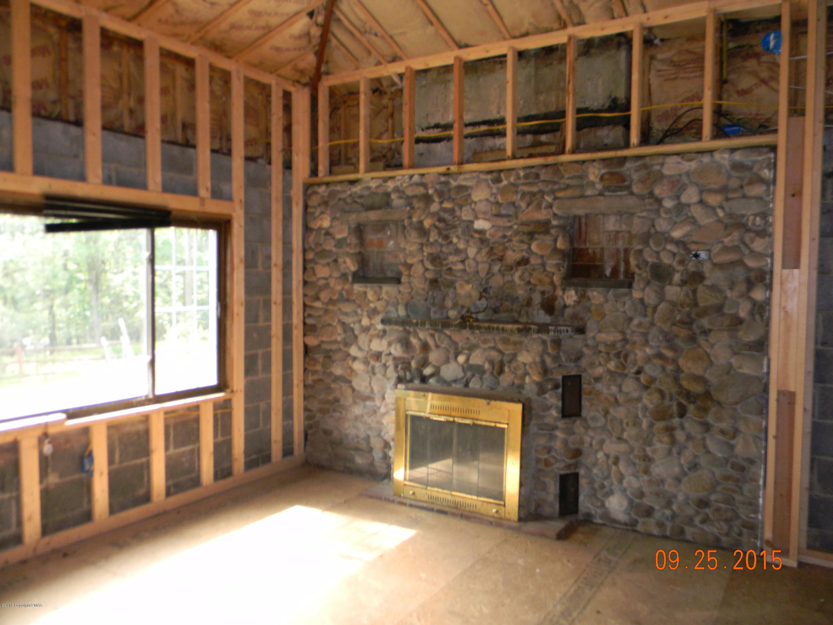 1607 Roberts Road Effort, PA 18330 - Photo 7 of 8 a view of an empty room with a fireplace
