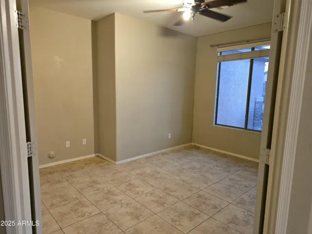 an empty room with a mirror