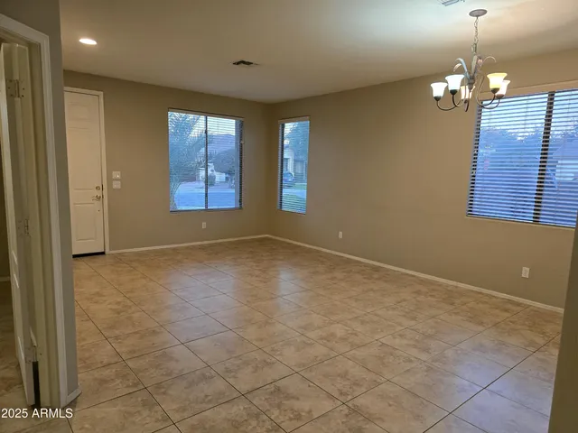 a view of an empty room with glass door