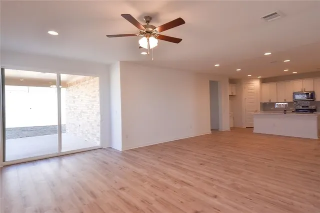 a kitchen with kitchen island a sink stainless steel appliances and cabinets