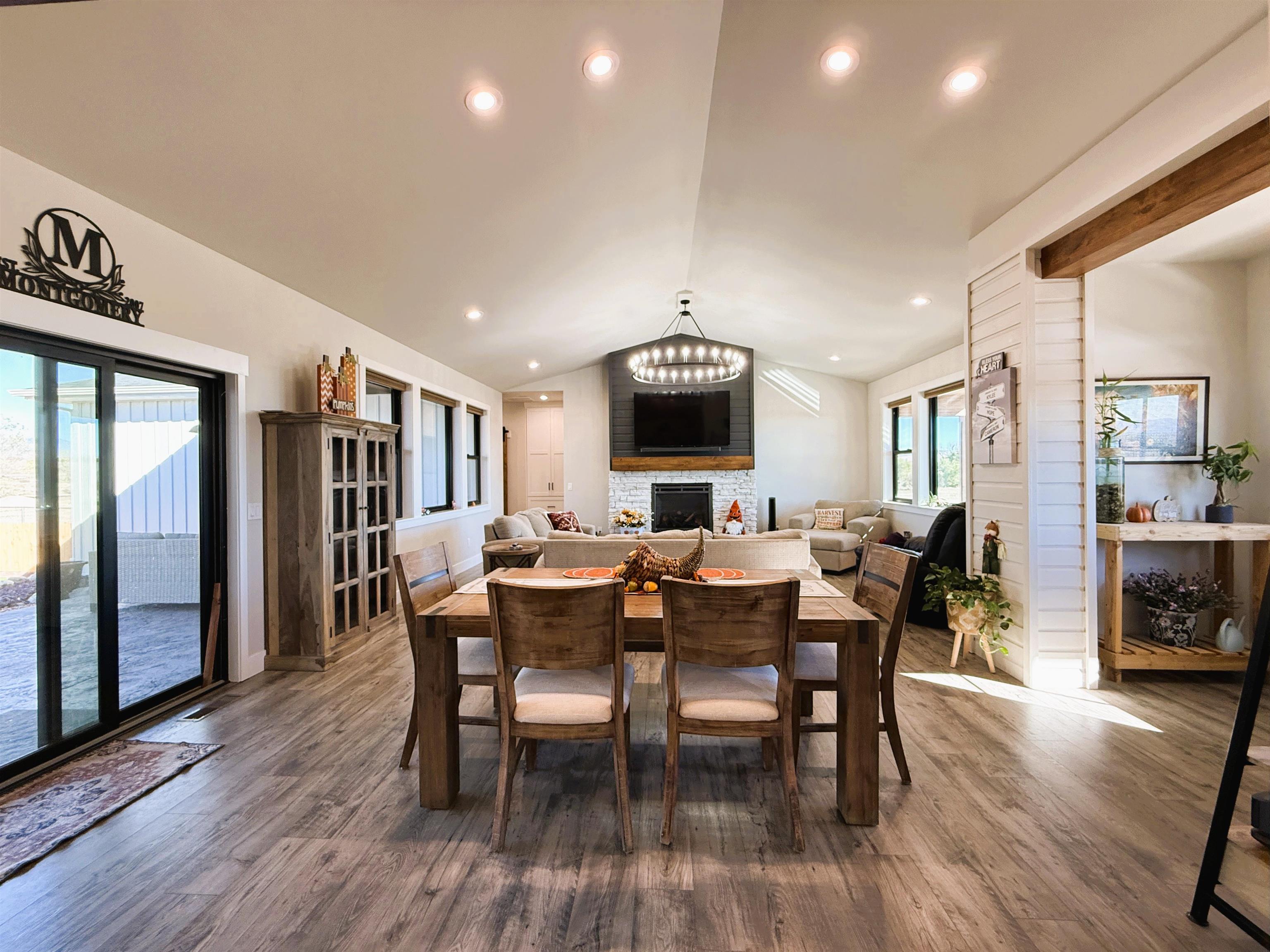 8585 Ellen's Way Austin, CO 81410 - Photo 13 of 42 a view of a dining room with furniture window and wooden floor