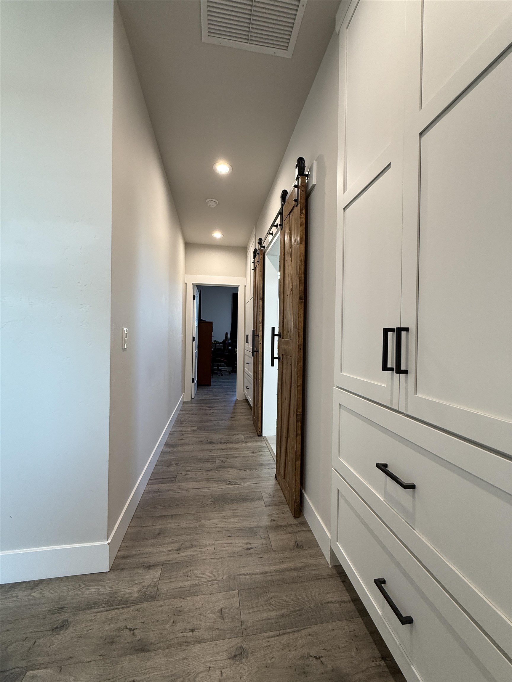 8585 Ellen's Way Austin, CO 81410 - Photo 36 of 42 a view of hallway with wooden floor