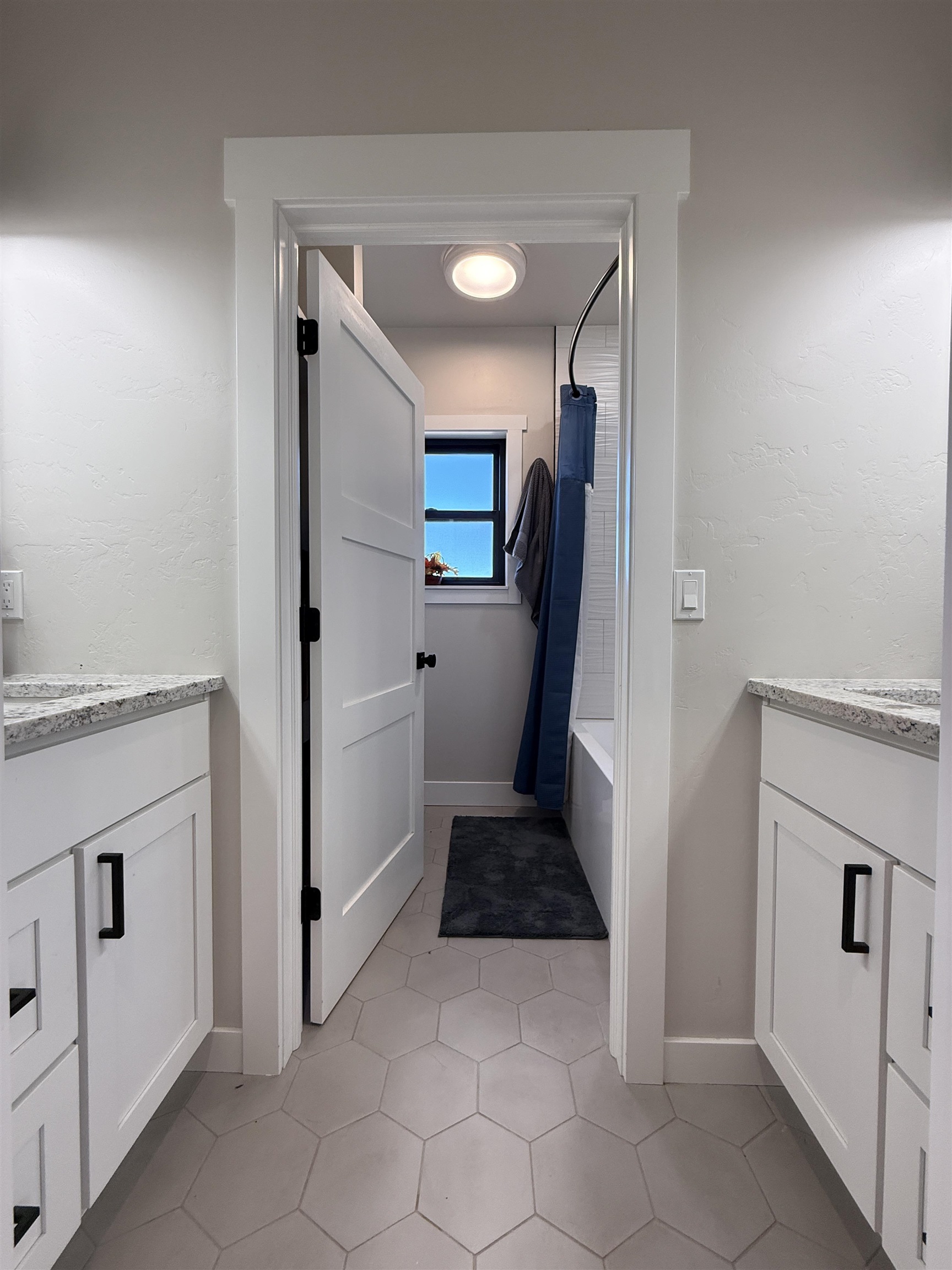 8585 Ellen's Way Austin, CO 81410 - Photo 39 of 42 a kitchen with a refrigerator and white cabinets